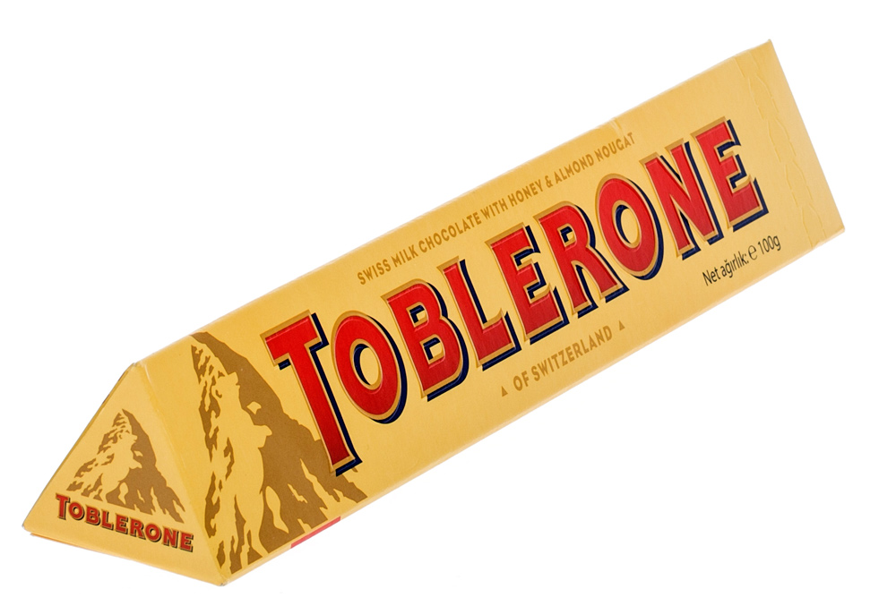 Таблерон шоколадка. Toblerone 100г. Шоколад Тоблерон молочный 100г. Молочный шоколад Таблерон с нугой 100гр. Шоколад Toblerone белый 100 г.